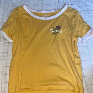 Yellow Hollister Tee shirt.